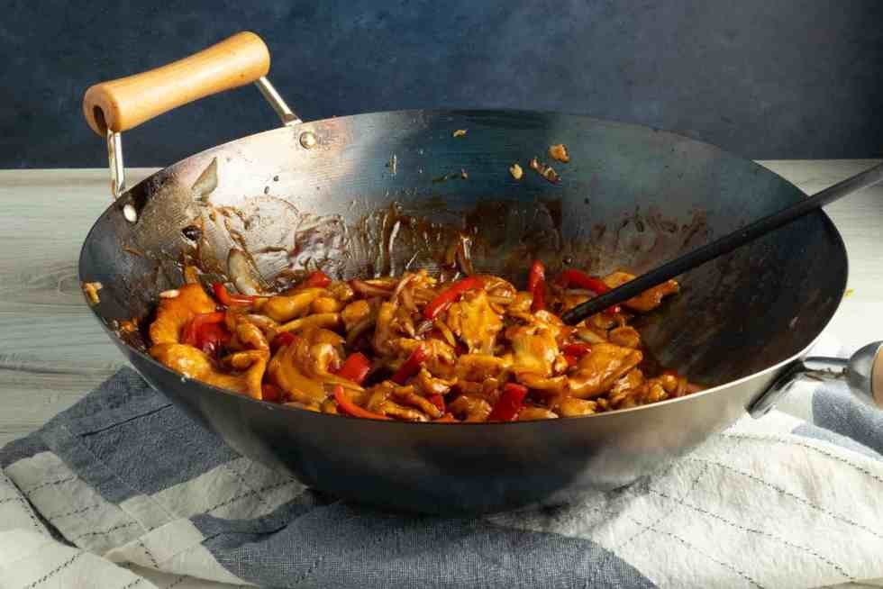 Why is wok cooking essential for Chinese stir-fries?