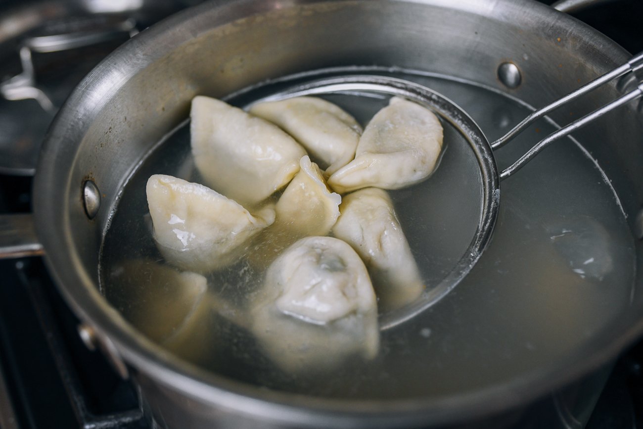 What are the key steps in making authentic Chinese dumplings?