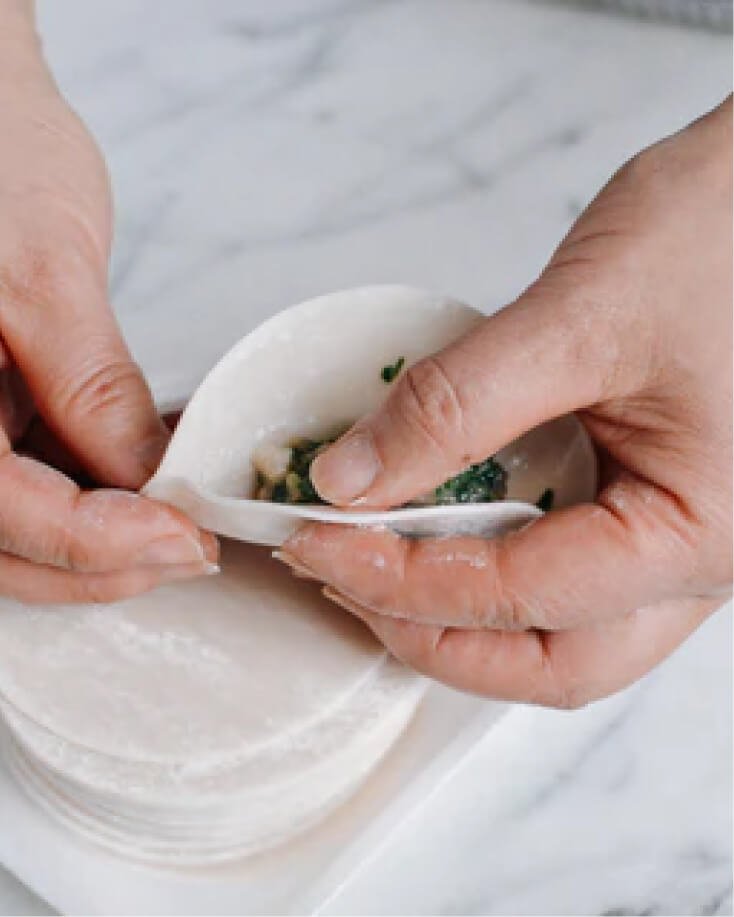 What are the key steps in making authentic Chinese dumplings?