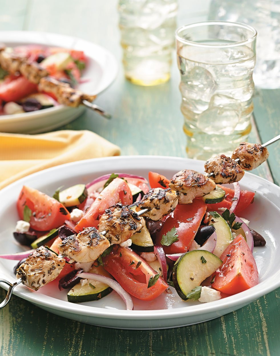 Which herbs enhance the flavor of Greek souvlaki?